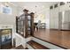 Open-concept dining area with hardwood floors, chandelier lighting, and stainless steel appliances at 226 Chastain Preserve Ne Ln, Atlanta, GA 30342