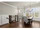 Spacious dining area with hardwood floors, elegant chandelier, and natural light at 226 Chastain Preserve Ne Ln, Atlanta, GA 30342