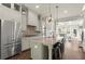 Gourmet kitchen featuring granite countertops, stainless steel appliances, and a central island with seating at 226 Chastain Preserve Ne Ln, Atlanta, GA 30342