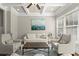 Bright living room with a decorative ceiling, large windows and comfortable seating at 226 Chastain Preserve Ne Ln, Atlanta, GA 30342