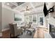 Cozy living room featuring hardwood floors, tray ceilings, a fireplace and ample seating at 226 Chastain Preserve Ne Ln, Atlanta, GA 30342
