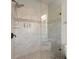 Modern walk-in shower features sleek tile work, a rainfall shower head and a built-in shower seat at 226 Chastain Preserve Ne Ln, Atlanta, GA 30342