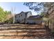 Expansive backyard with plenty of space for outdoor activities and entertaining on a sunny day at 25 Shadowbrook Ct, Covington, GA 30014