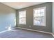 This bedroom features a neutral color scheme, plush carpeting, and natural light at 25 Shadowbrook Ct, Covington, GA 30014