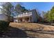 Charming two-story home with a covered porch and manicured lawn in a peaceful, wooded setting at 25 Shadowbrook Ct, Covington, GA 30014