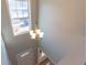 A beautiful foyer featuring a chandelier, a glass window and new flooring at 25 Shadowbrook Ct, Covington, GA 30014