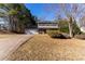 Traditional two-story home with a two-car garage and a well-maintained front lawn at 25 Shadowbrook Ct, Covington, GA 30014