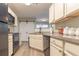Efficient kitchen with modern appliances, ample counter space, and a view to the living area at 25 Shadowbrook Ct, Covington, GA 30014