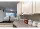 Kitchen sink with updated countertops and barn doors at 25 Shadowbrook Ct, Covington, GA 30014