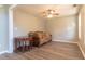 Cozy living room with neutral walls, ceiling fan, and wood-look flooring at 25 Shadowbrook Ct, Covington, GA 30014