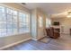 Bright living room featuring large windows and new flooring at 25 Shadowbrook Ct, Covington, GA 30014
