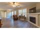 Bright living room features a fireplace and large windows at 25 Shadowbrook Ct, Covington, GA 30014