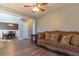 Bright living room with stylish sofa, light walls, and hardwood floors, creating a warm atmosphere at 25 Shadowbrook Ct, Covington, GA 30014