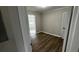 Cozy bedroom featuring wood floors and neutral walls at 110 Raymond St, Jonesboro, GA 30236