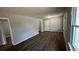 Open living room featuring wood flooring and a view into the entry door at 110 Raymond St, Jonesboro, GA 30236