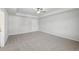 Bedroom displaying neutral carpet, a ceiling fan, and a double door closet at 11844 Rizvan Pl, Covington, GA 30014