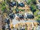 Aerial view of property showing landscaping, neighborhood, and proximity to other homes at 1897 De Winton Pl, Lawrenceville, GA 30043