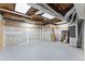 Unfinished basement provides ample space for storage or future expansion and customization at 1897 De Winton Pl, Lawrenceville, GA 30043