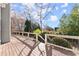 A spacious wooden deck offers views of the trees and provides an outdoor entertaining space at 1897 De Winton Pl, Lawrenceville, GA 30043