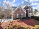 Beautiful brick home with a manicured front yard, featuring a bright, open exterior at 1897 De Winton Pl, Lawrenceville, GA 30043