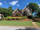 Brick home with immaculate lawn and beautiful landscaping at 1897 De Winton Pl, Lawrenceville, GA 30043