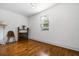 Bright bedroom featuring hardwood floors, fresh paint, and natural light at 658 Woods Dr, Atlanta, GA 30318