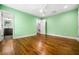 Bedroom with en suite bathroom and hardwood floors and a ceiling fan at 658 Woods Dr, Atlanta, GA 30318