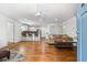 Bright and airy living room featuring an open floor plan, hardwood floors, and stylish furnishings at 658 Woods Dr, Atlanta, GA 30318