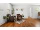 Living room features hardwood floors and a cozy seating area with armchairs at 658 Woods Dr, Atlanta, GA 30318