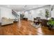 Inviting living room with hardwood floors, bright white walls, modern furnishings and staircase at 658 Woods Dr, Atlanta, GA 30318