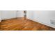 Bright living room with freshly painted walls, hardwood floors, and a classic white door at 658 Woods Dr, Atlanta, GA 30318