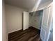 View of the closet with wood floor and white trim at 8666 Webb Rd, Riverdale, GA 30274