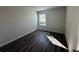 Sunlit bedroom with wood-look floors and a view of the blinds at 8668 Webb Rd, Riverdale, GA 30274