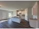 Modern kitchen with granite countertops, white cabinets, stainless steel sink, and an island at 8668 Webb Rd, Riverdale, GA 30274