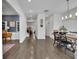 Open dining room with hardwood floors, modern lighting, and views to other rooms at 1889 Felker Ward Nw St, Atlanta, GA 30318