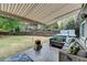 Expansive backyard with well-maintained lawn, patio, hot tub, and volleyball net at 245 Davenham Ct, Alpharetta, GA 30005