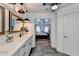 Bathroom with marble countertops, modern fixtures, and view of bedroom at 245 Davenham Ct, Alpharetta, GA 30005