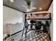 Bedroom with a bunk bed, desk, and white brick feature wall at 245 Davenham Ct, Alpharetta, GA 30005