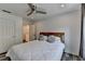 Bedroom with a queen bed, hard surface floors, and modern ceiling fan at 245 Davenham Ct, Alpharetta, GA 30005