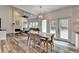 Dining area with marble table and seating for four, with open concept design and door to backyard at 245 Davenham Ct, Alpharetta, GA 30005