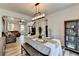 Cozy dining area connected to living space, featuring wood accents, chandelier lighting and easy stair access at 245 Davenham Ct, Alpharetta, GA 30005