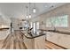 Bright kitchen featuring a center island with marble accents, stainless steel appliances, and an open layout at 245 Davenham Ct, Alpharetta, GA 30005