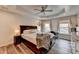 Serene main bedroom featuring tray ceilings, natural light, and a cozy decor with accent pillows at 245 Davenham Ct, Alpharetta, GA 30005