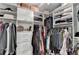 Walk-in closet with custom shelving and ample storage for clothes and accessories at 245 Davenham Ct, Alpharetta, GA 30005
