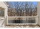 Balcony with white railing overlooking the trees outside at 111 Paces Run, Atlanta, GA 30339