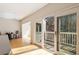 Open kitchen with access to the wooden balcony with views of the serene backyard at 111 Paces Run, Atlanta, GA 30339