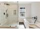 Modern bathroom with glass shower and a white tub at 111 Paces Run, Atlanta, GA 30339