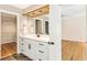 Bathroom vanity with granite countertop and walk-in closet view at 111 Paces Run, Atlanta, GA 30339