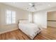 Cozy bedroom featuring a comfortable bed, ample natural light, and hardwood flooring at 111 Paces Run, Atlanta, GA 30339