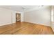 Spacious bedroom with hardwood floors, bright natural light and white trim, offers a clean and welcoming atmosphere at 111 Paces Run, Atlanta, GA 30339